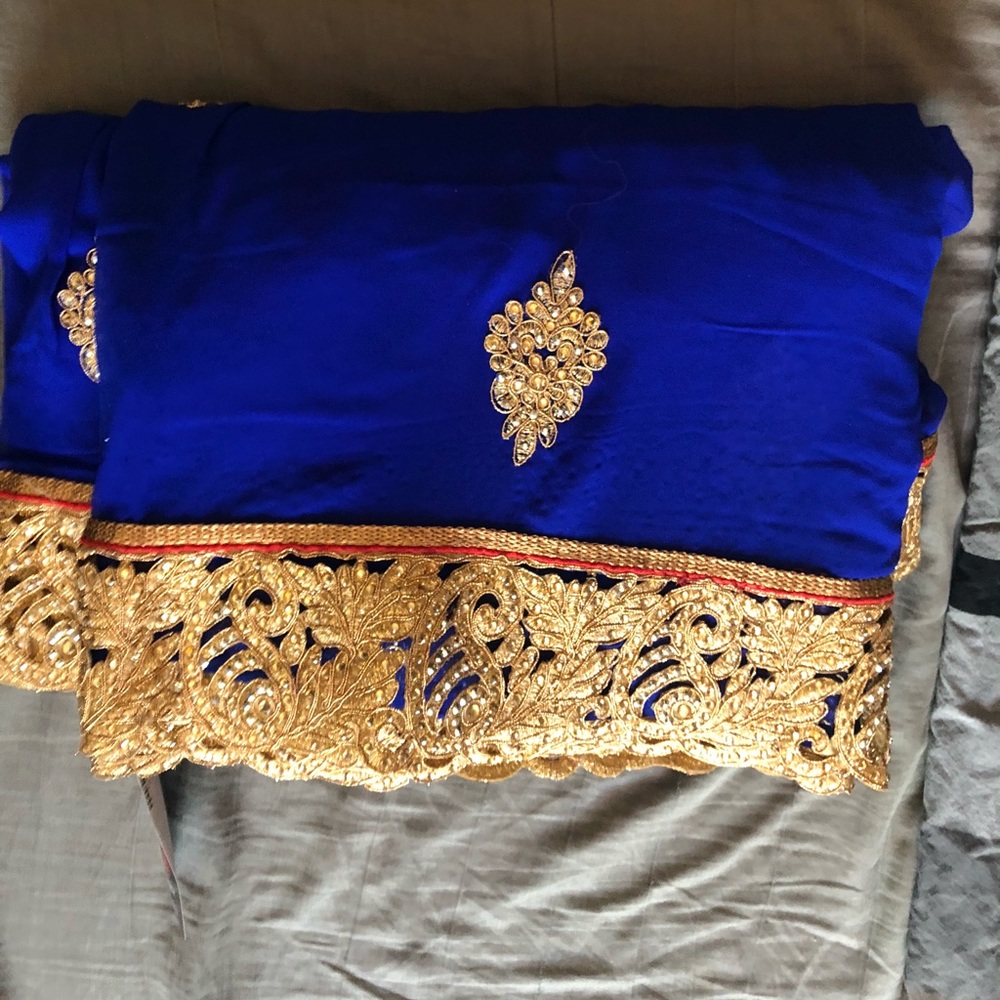 Beautiful royal blue and gold unstitched saree.